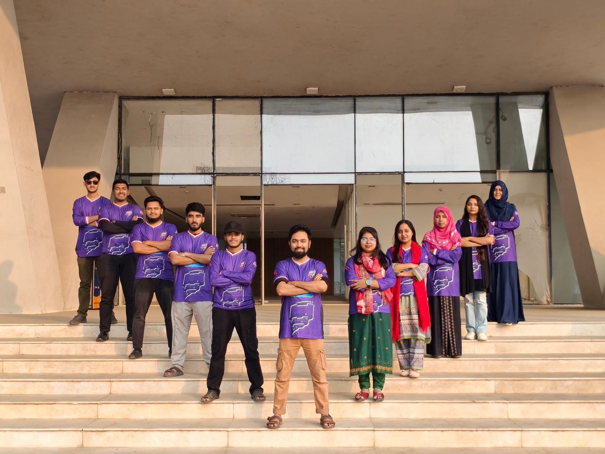 The team on the steps at the office entrance